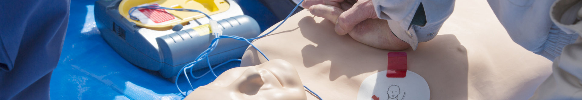 training using and an AED and bag mask valve on an adult training manikin